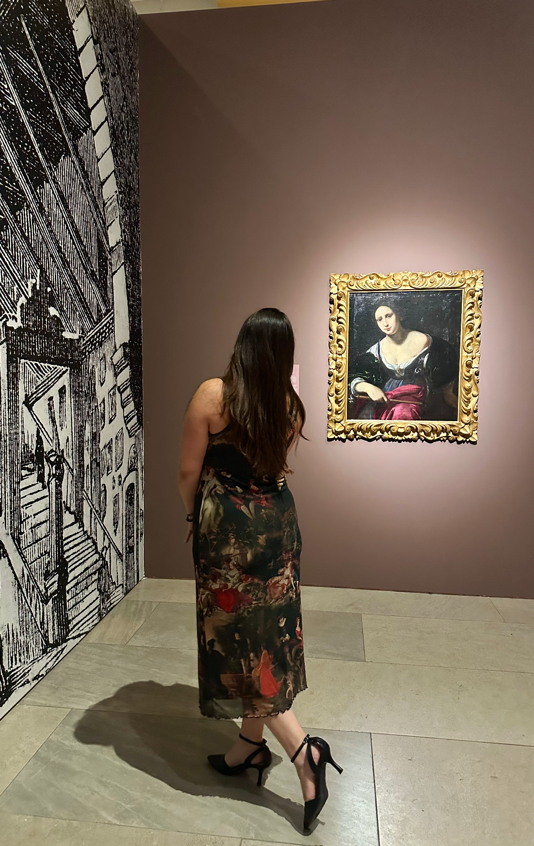 Madelaine viewing a historic portrait in an art museum